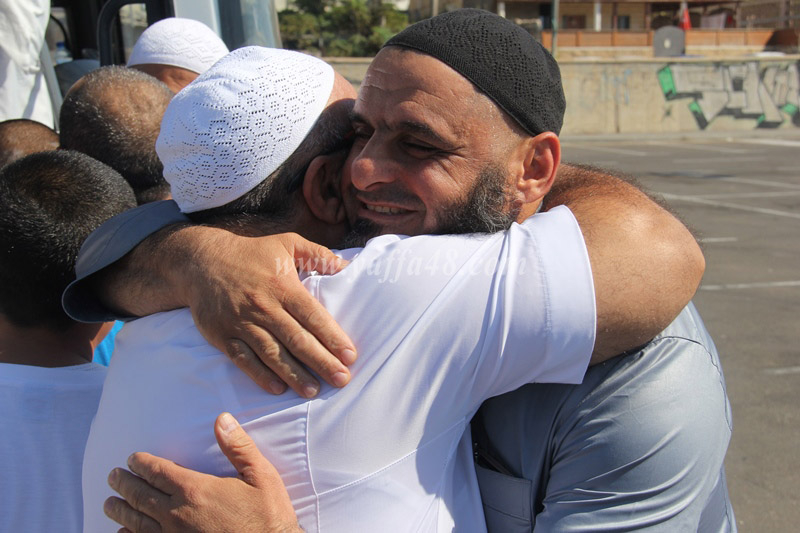 بالصور: عودة الفوج الأول من حجاج مدينة يافا إلى ديارهم سالمين 